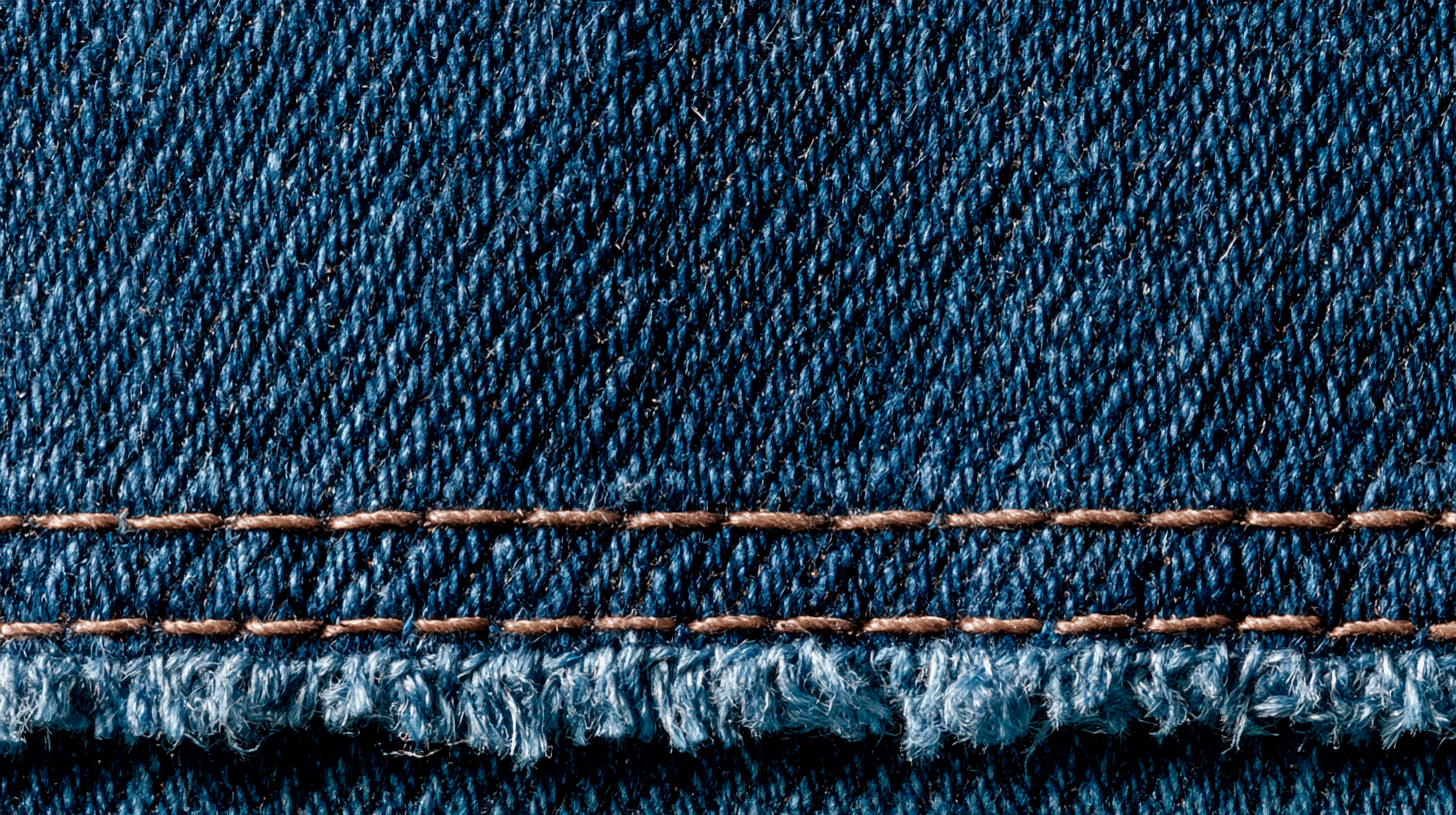 Heavy denim close-up — dense weave and topstitching, too heavy for summer dresses