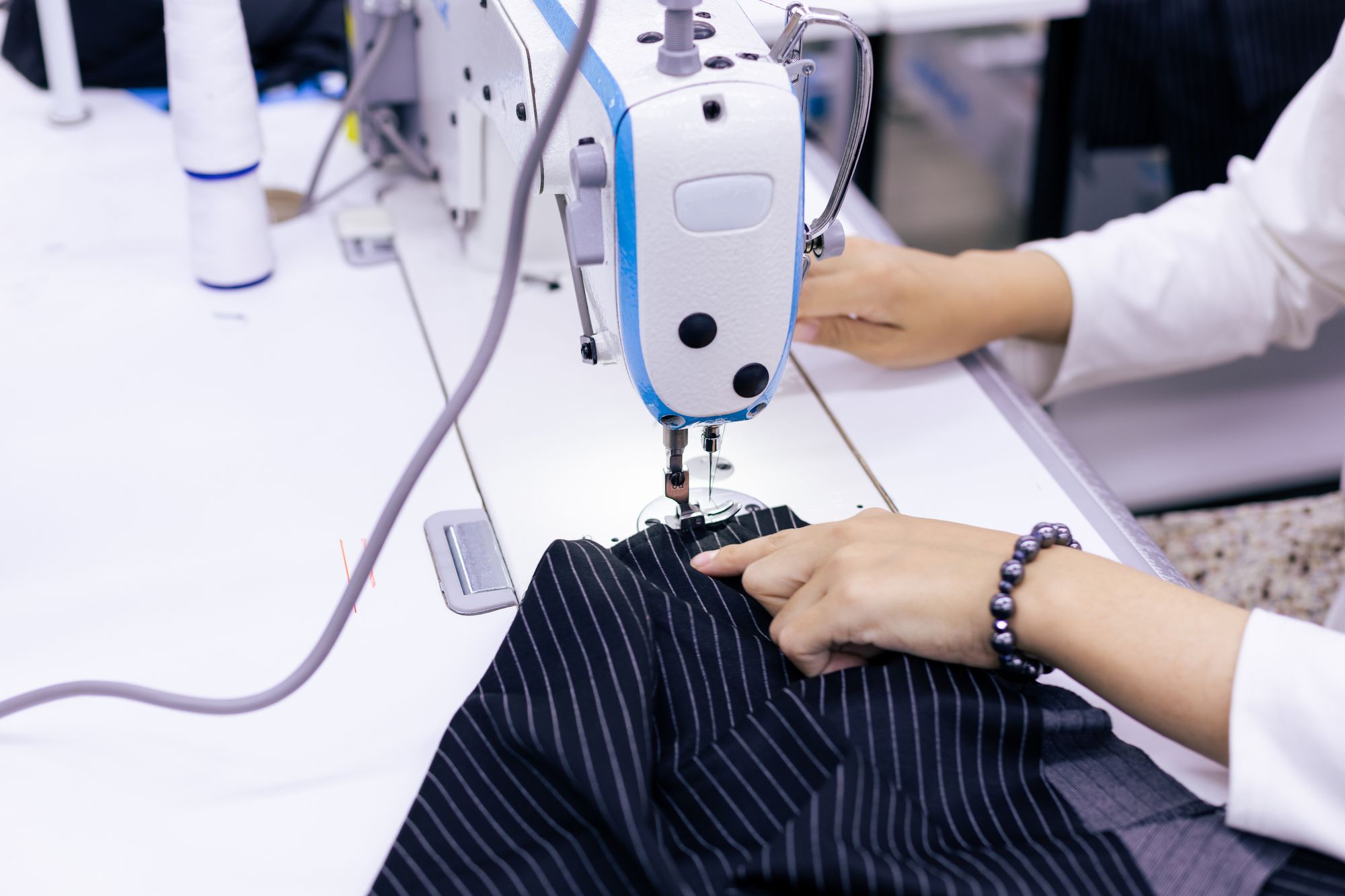 Sewing tailored fabric on a professional machine — Fabrico sewing patterns for apparel brands and makers
