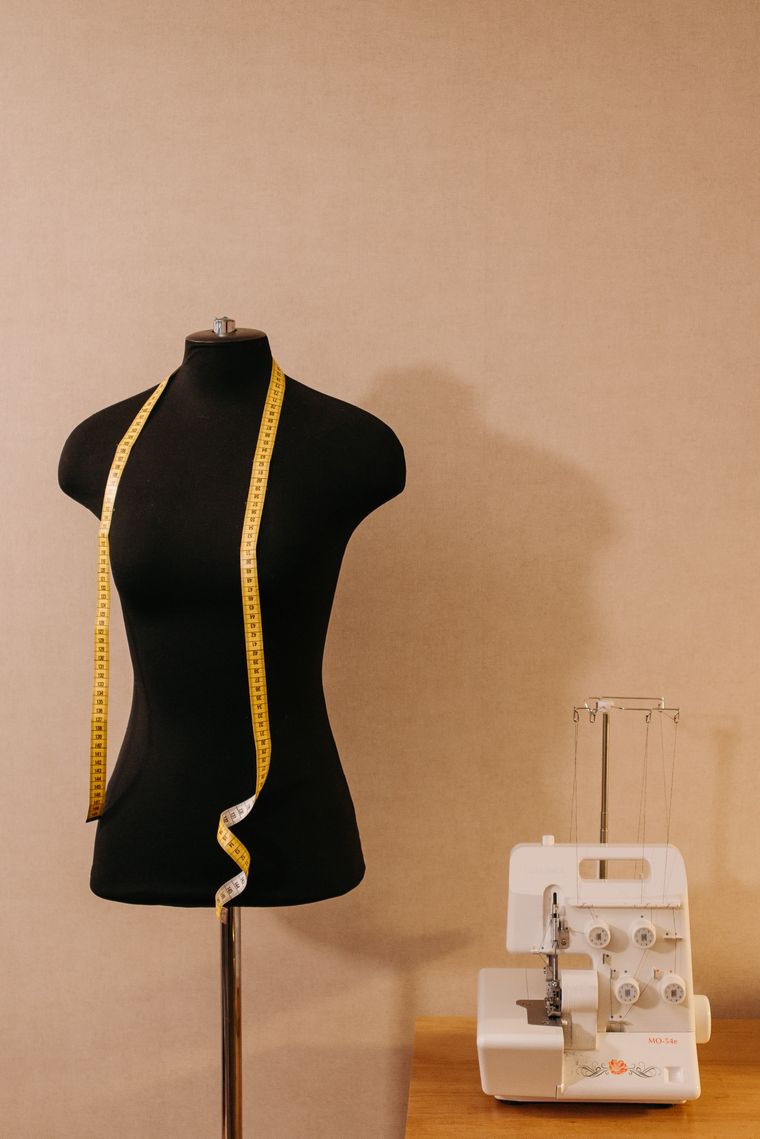 A dress form with a measuring tape